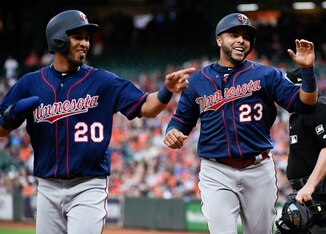 Eddie Rosario (L) and Nelson Cruz (R)
