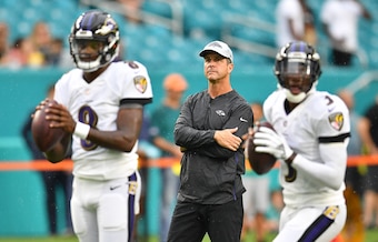 Baltimore Ravens quarterbacks Lamar Jackson and Robert Griffin III