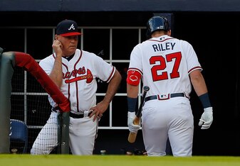 Brian Snitker (L) and Austin Riley (R)