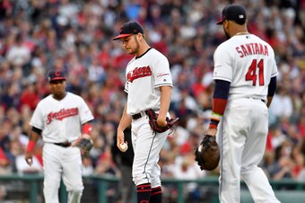 Jose Ramirez (L), Trevor Bauer (C) and Carlos Santana (R)