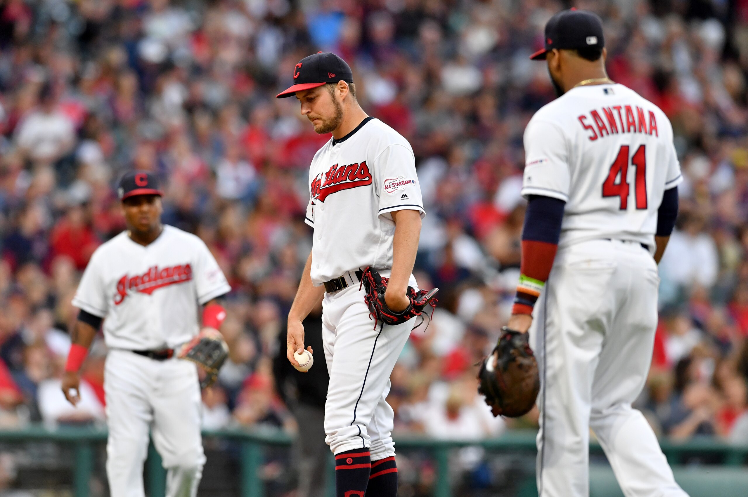 Jose Ramirez (L), Trevor Bauer (C) and Carlos Santana (R)