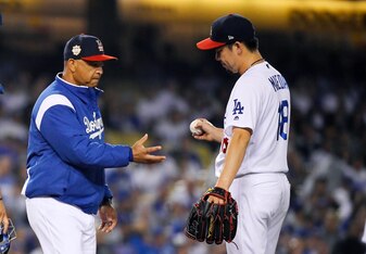 Dave Roberts (L) and Kenta Maeda (R)