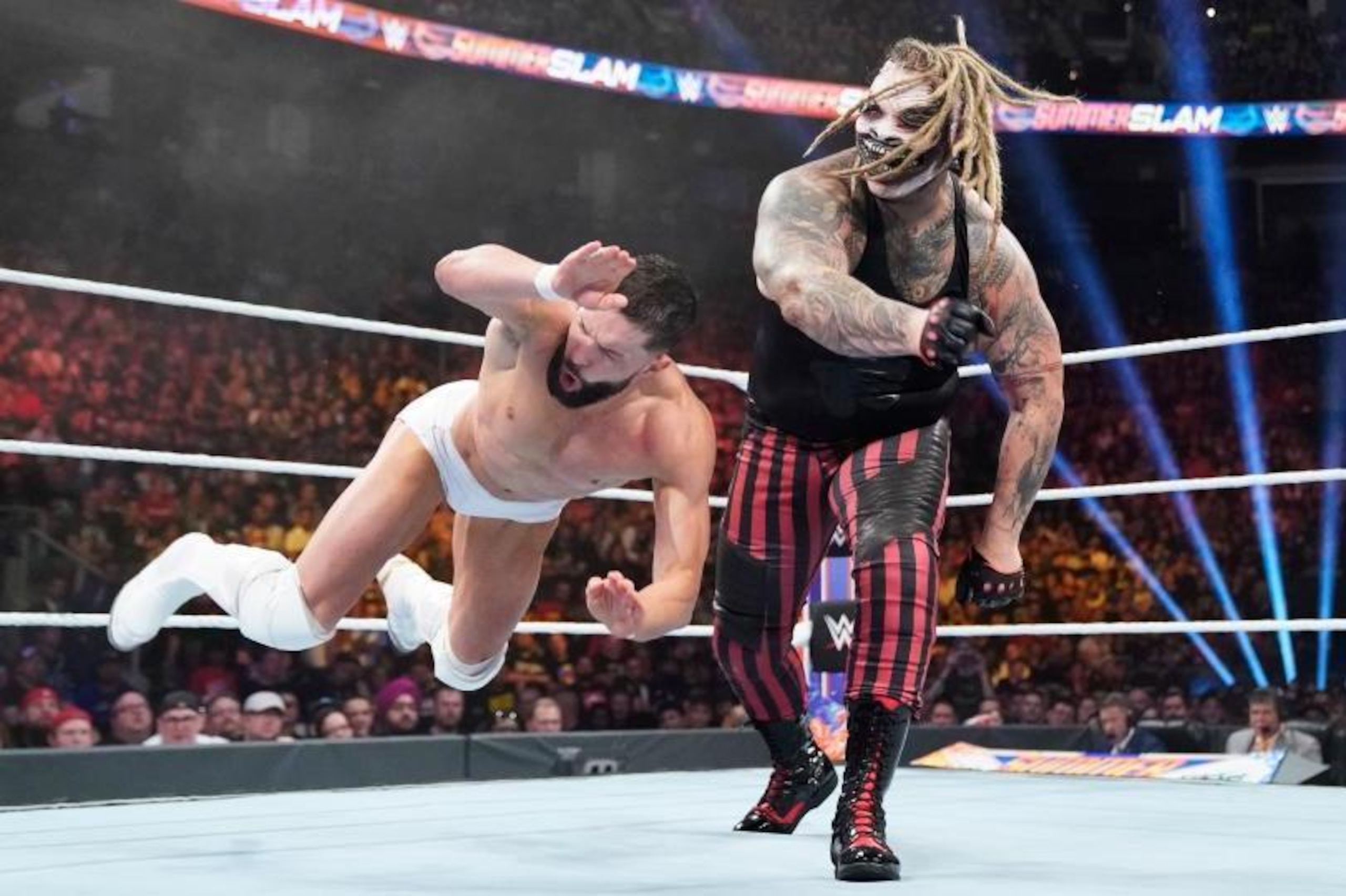Finn Balor being brutalized by Bray Wyatt.