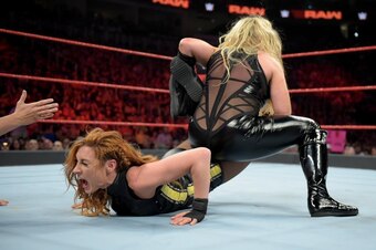 Natalya putting Becky Lynch in the Sharpshooter.