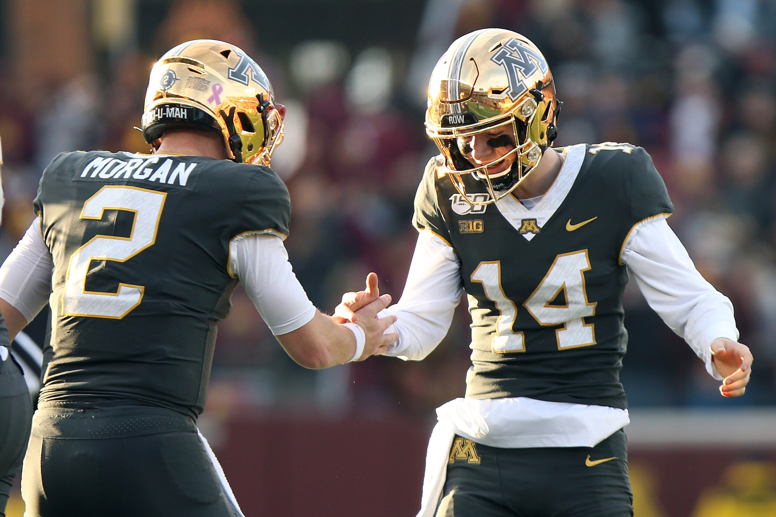 Minnesota's Tanner Morgan (2) and Cole Kramer (14) Minnesota's Tanner Morgan (2) and Cole Kramer (14)