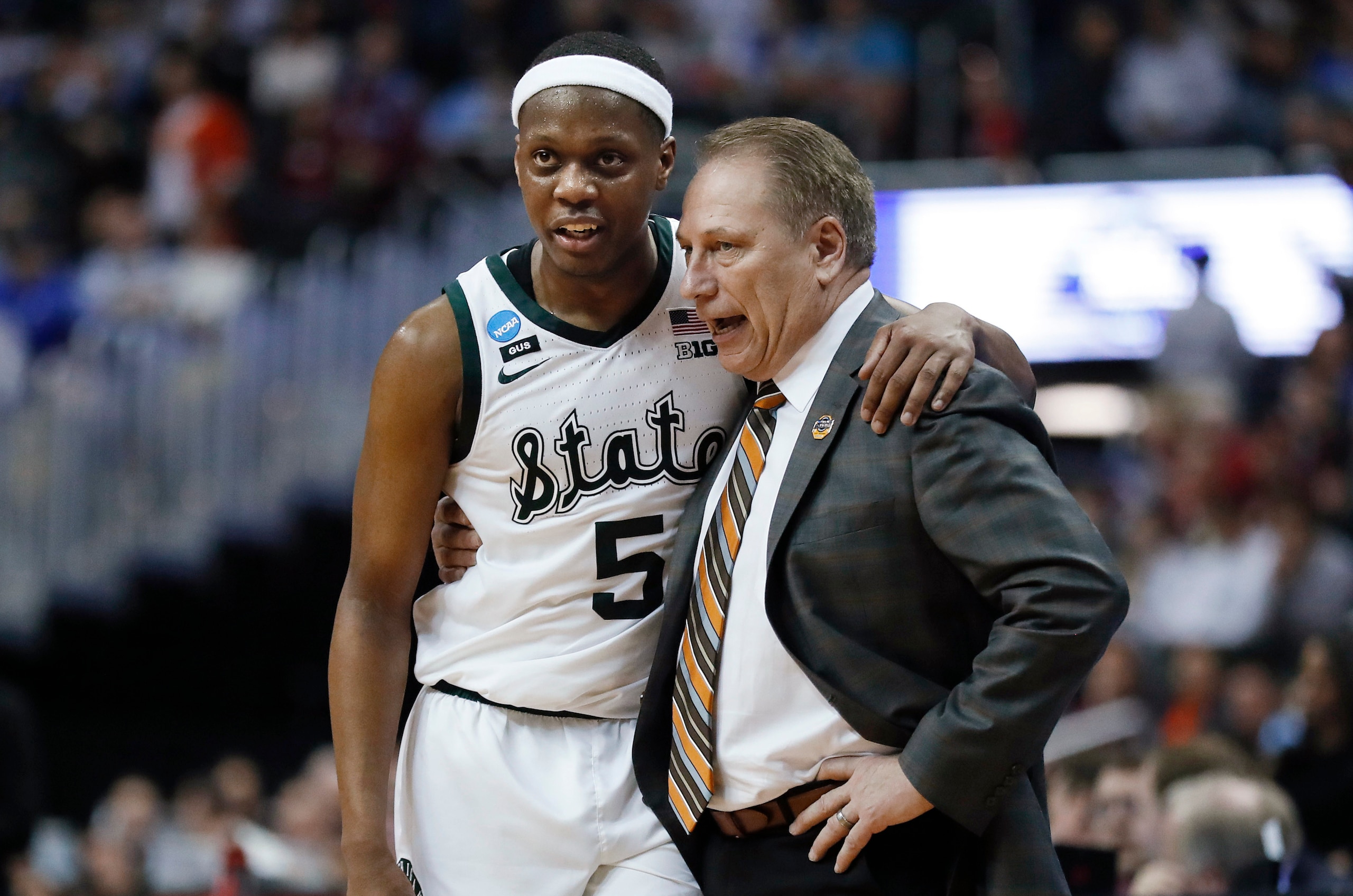 Michigan State's Cassius Winston and Tom Izzo