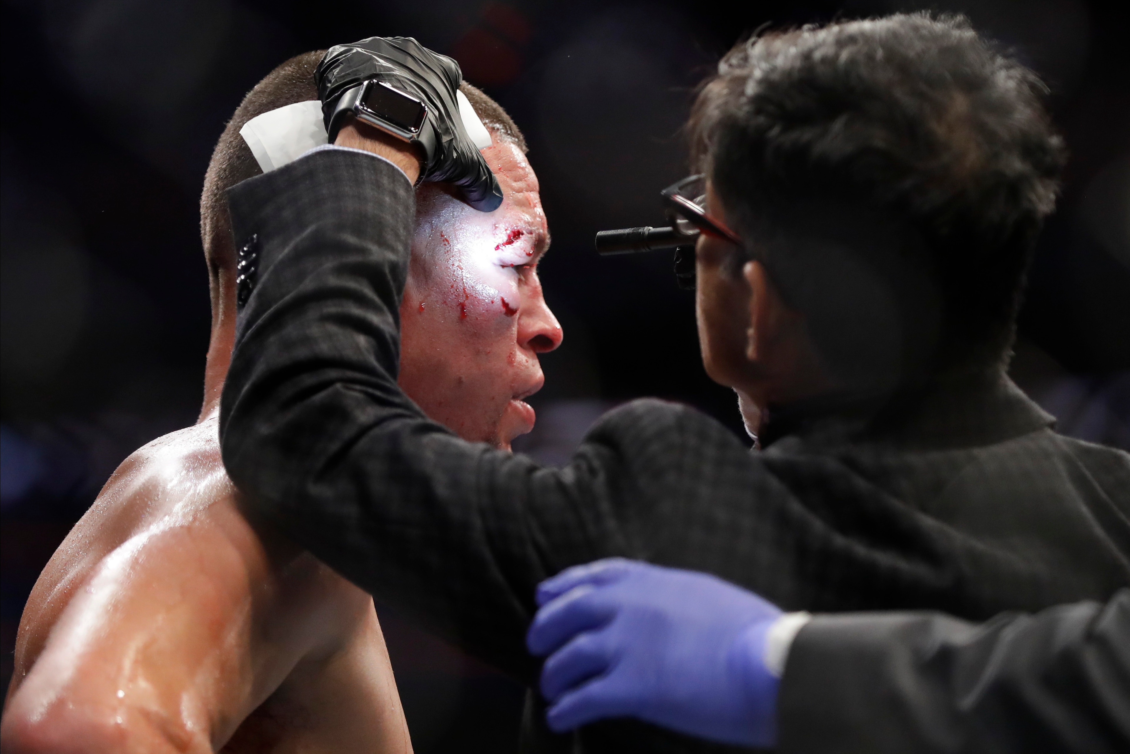 Dr. Nitin Sethi (right) examines Nate Diaz Dr. Nitin Sethi (right) examines Nate Diaz