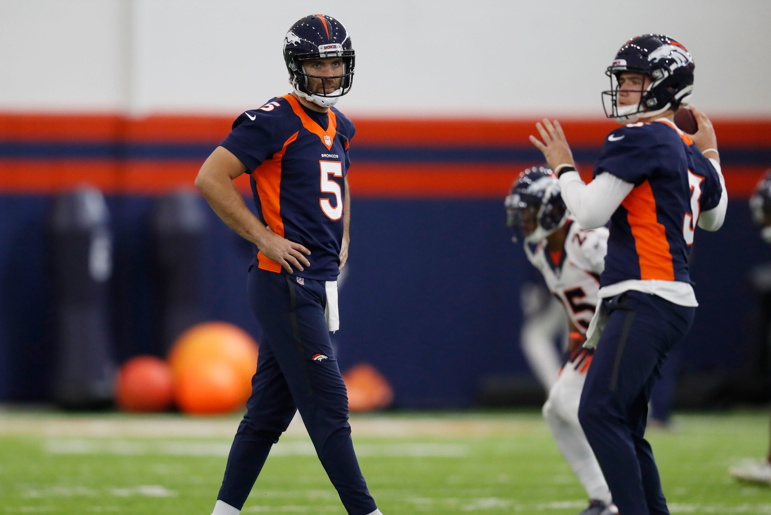 Broncos quarterbacks Joe Flacco (left) and Drew Lock