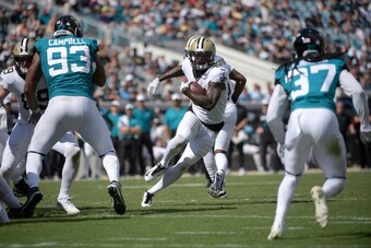 Jacksonville Jaguars defensive end Calais Campbell and cornerback Tre Herndon trying to close the gap on a run play.