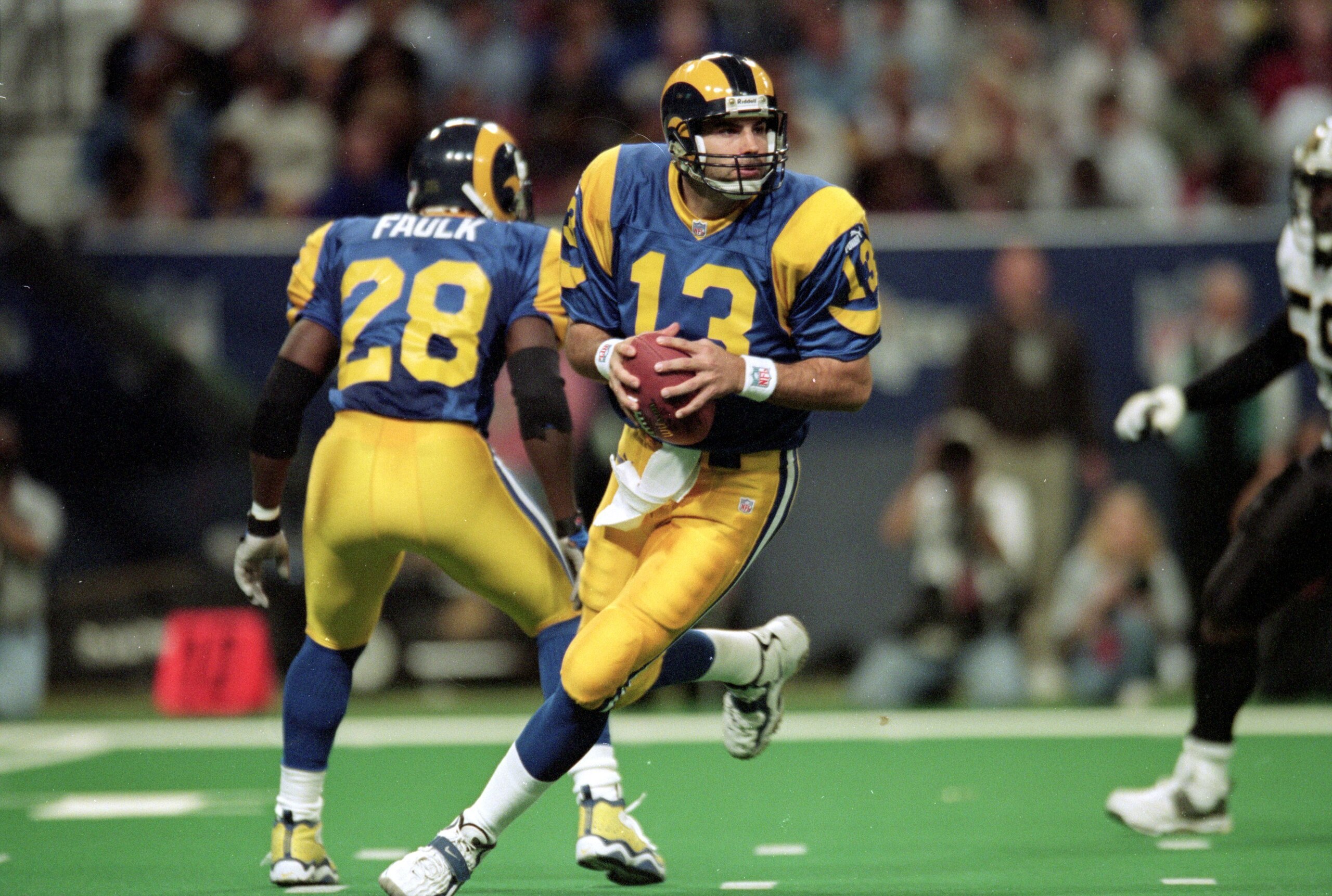28 Nov 1999: Kurt Warner #13 of the St. Louis Rams runs to pass the ball during a game against the New Orleans Saints at the Trans World Dome in St. Louis, Missouri. The Rams defeated the Saints 43-12. Mandatory Credit: Elsa Hasch  /Allsport