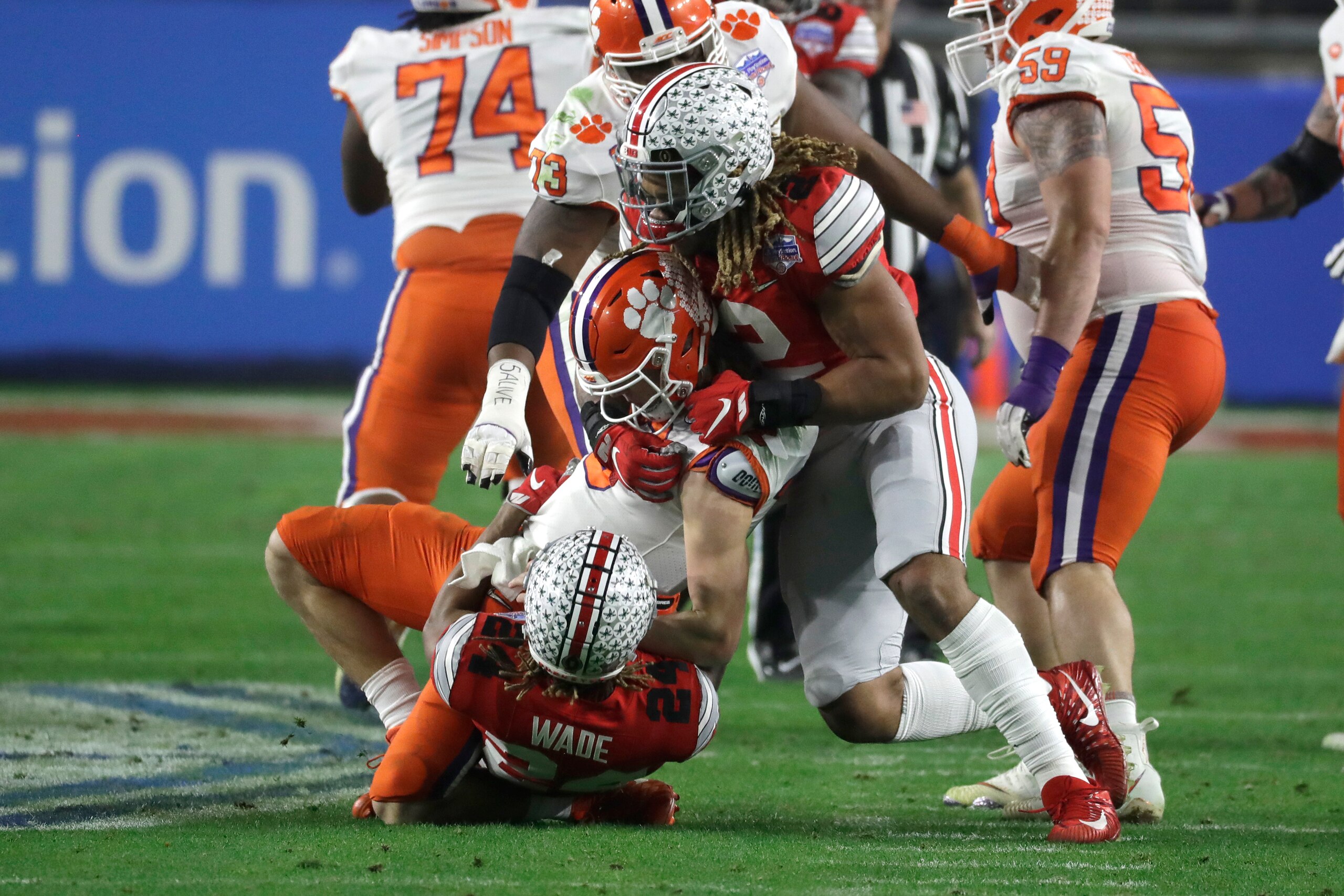 Ohio State's Shaun Wade and Chase Young wrap up Trevor Lawrence