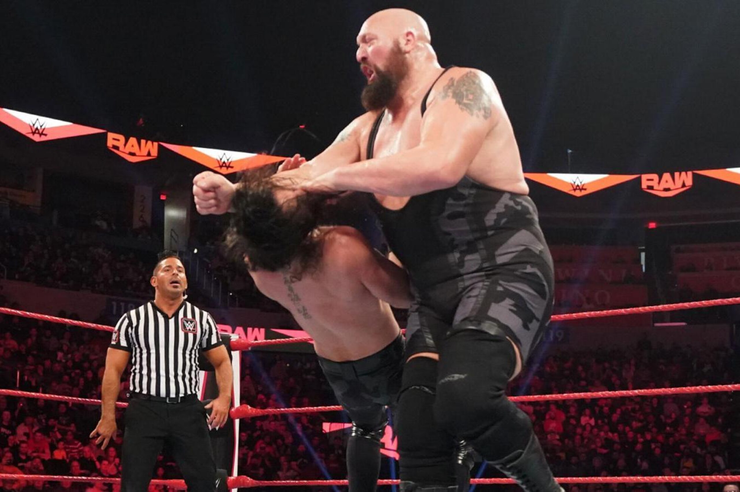Big Show taking down Seth Rollins.