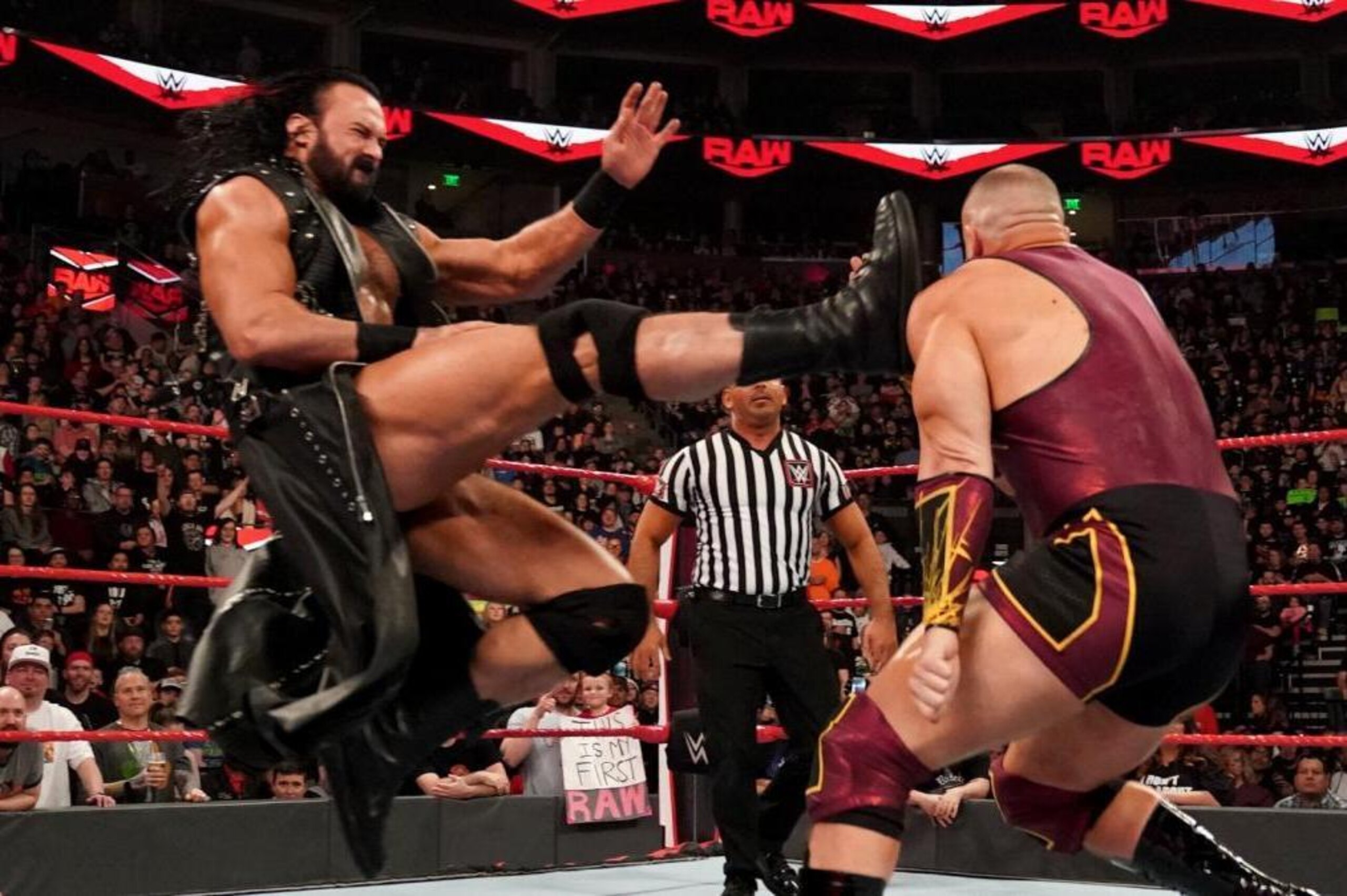 Drew McIntyre kicking Mojo Rawley.