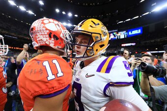 Isaiah Simmons (left) and Joe Burrow (right) after the national championship game