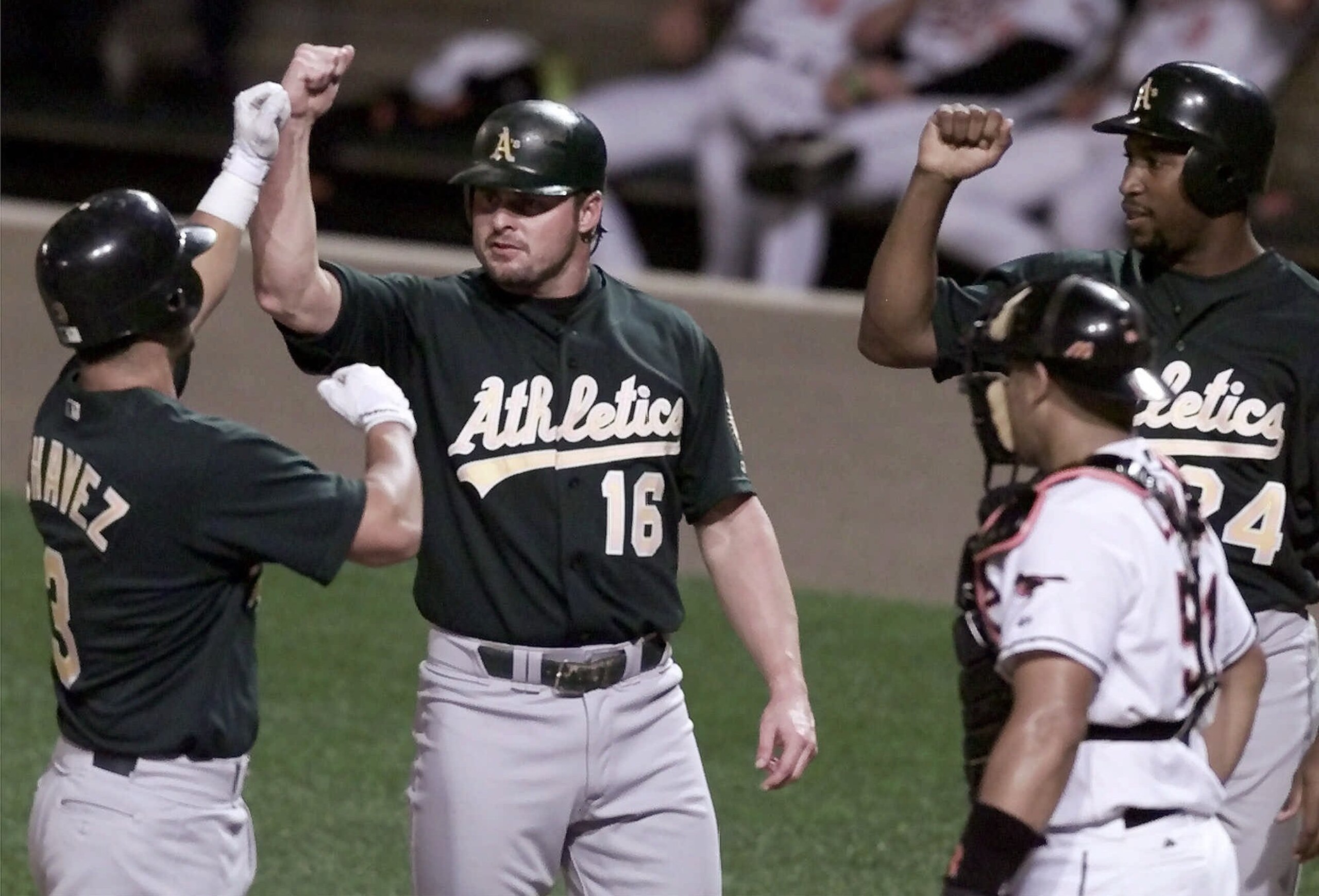 Eric Chavez (3), Jason Giambi (16) and Jermaine Dye (24)