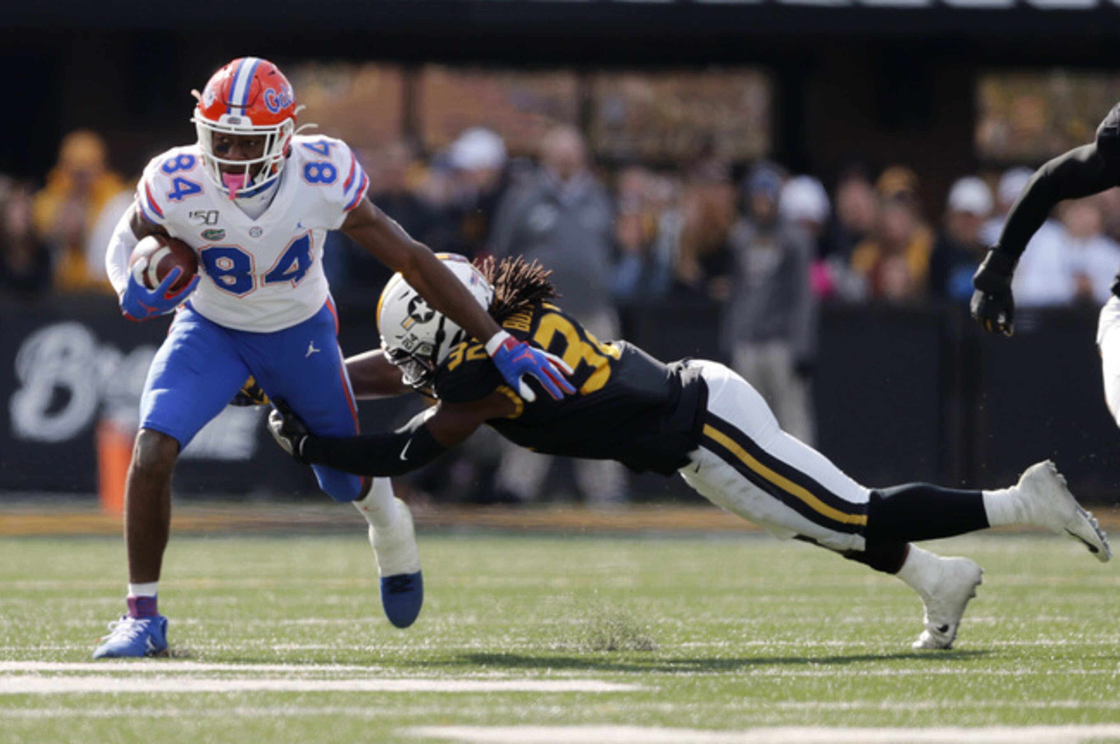 Nick Bolton makes the tackle.