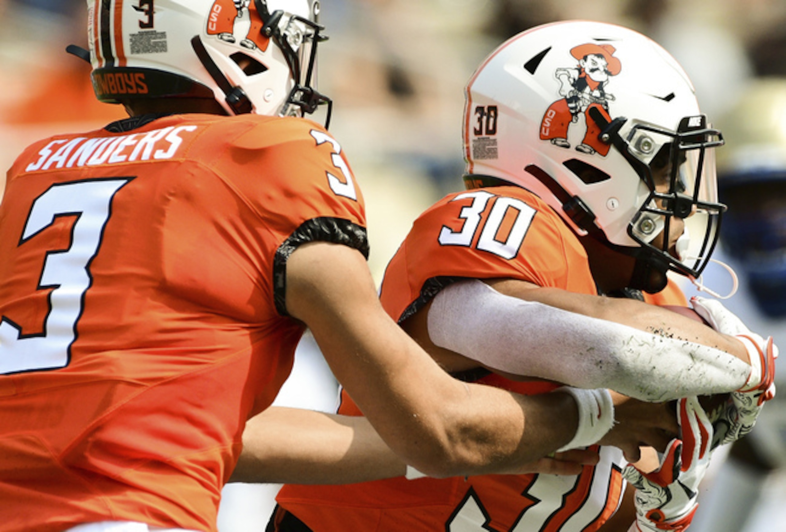 Oklahoma State's Spencer Sanders and Chuba Hubbard