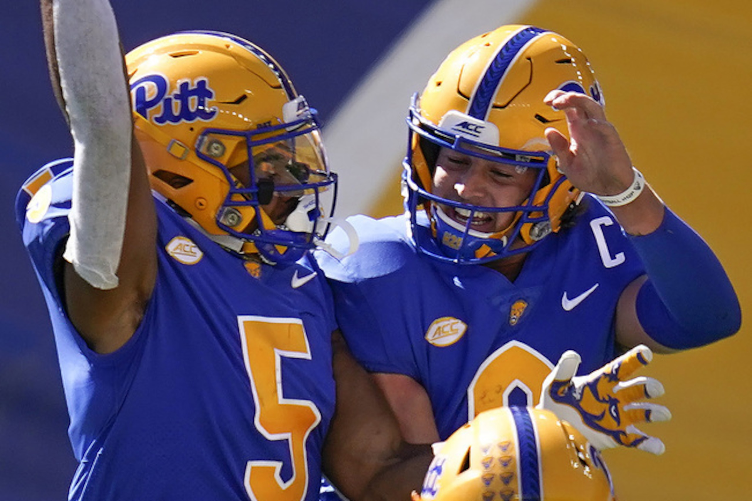 Pittsburgh's Jared Wayne (5) and Kenny Pickett (8)