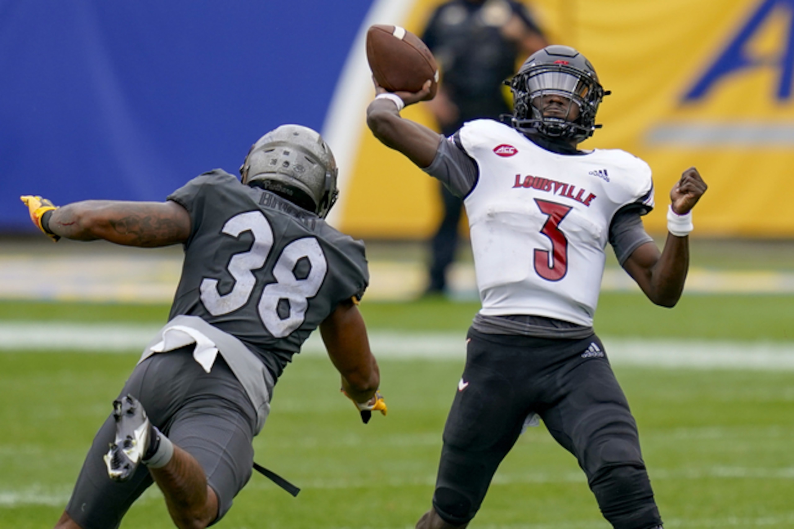 Pitt's Cam Bright and Louisville's Malik Cunningham