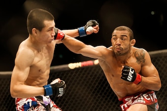 Chan Sung Jung (left) in a 2013 bout with Jose Aldo