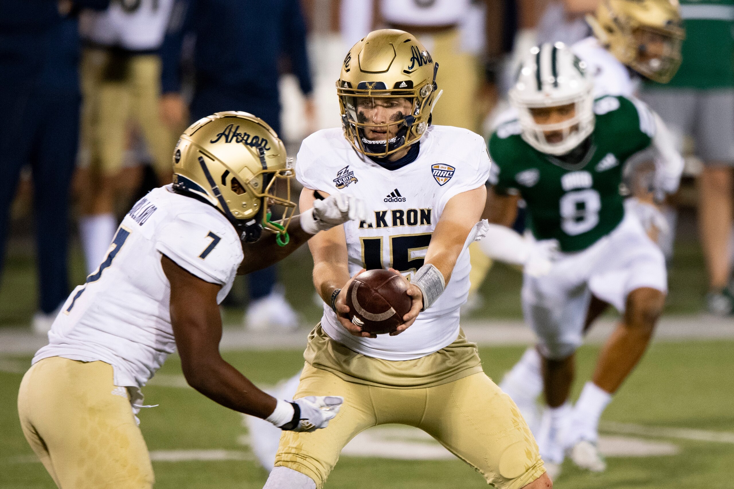 Akron's Teon Dollard (7) and Zach Gibson (15) Akron's Teon Dollard (7) and Zach Gibson (15)