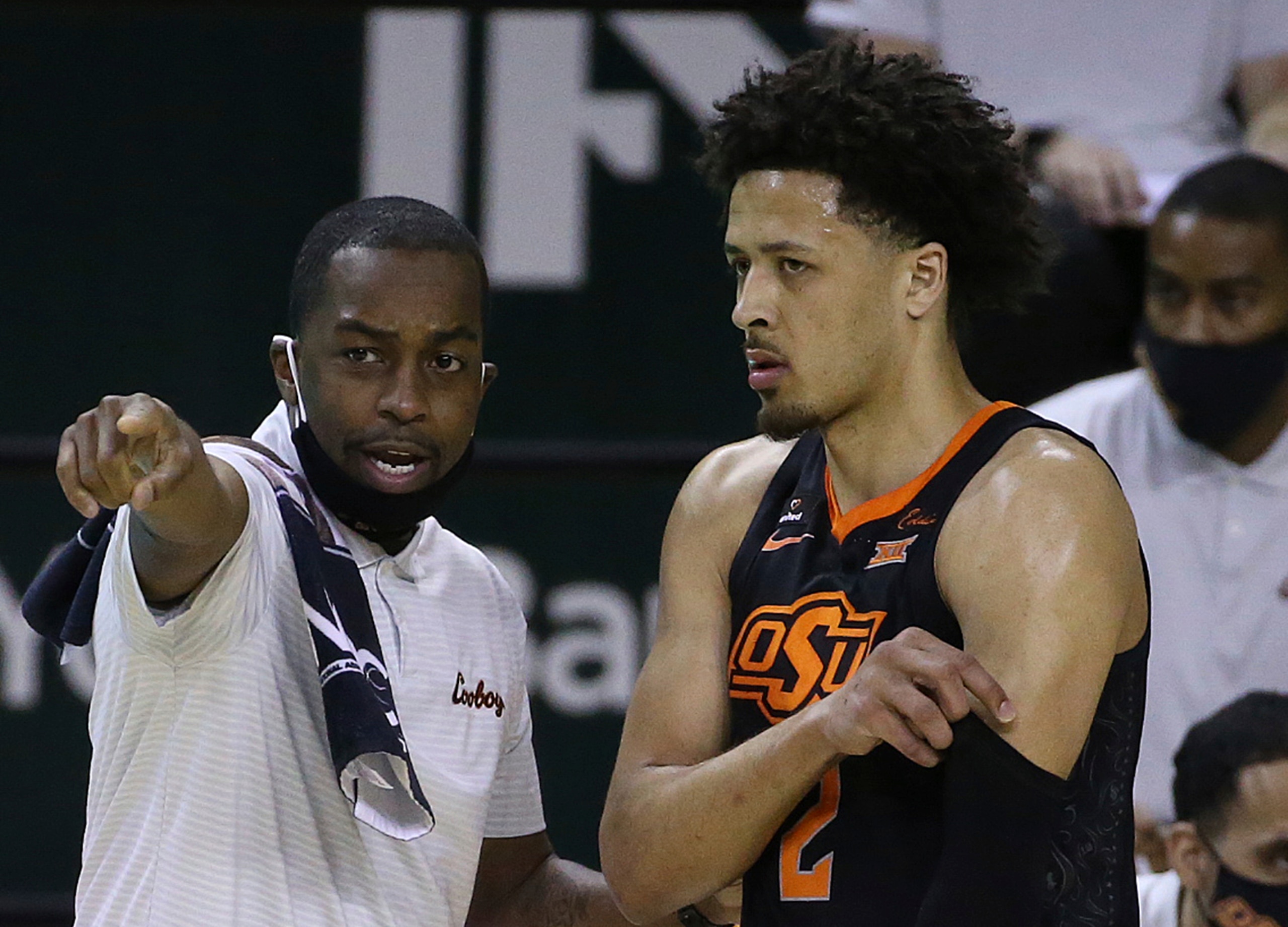 Oklahoma State's Cade Cunningham and Mike Boynton Oklahoma State's Cade Cunningham and Mike Boynton