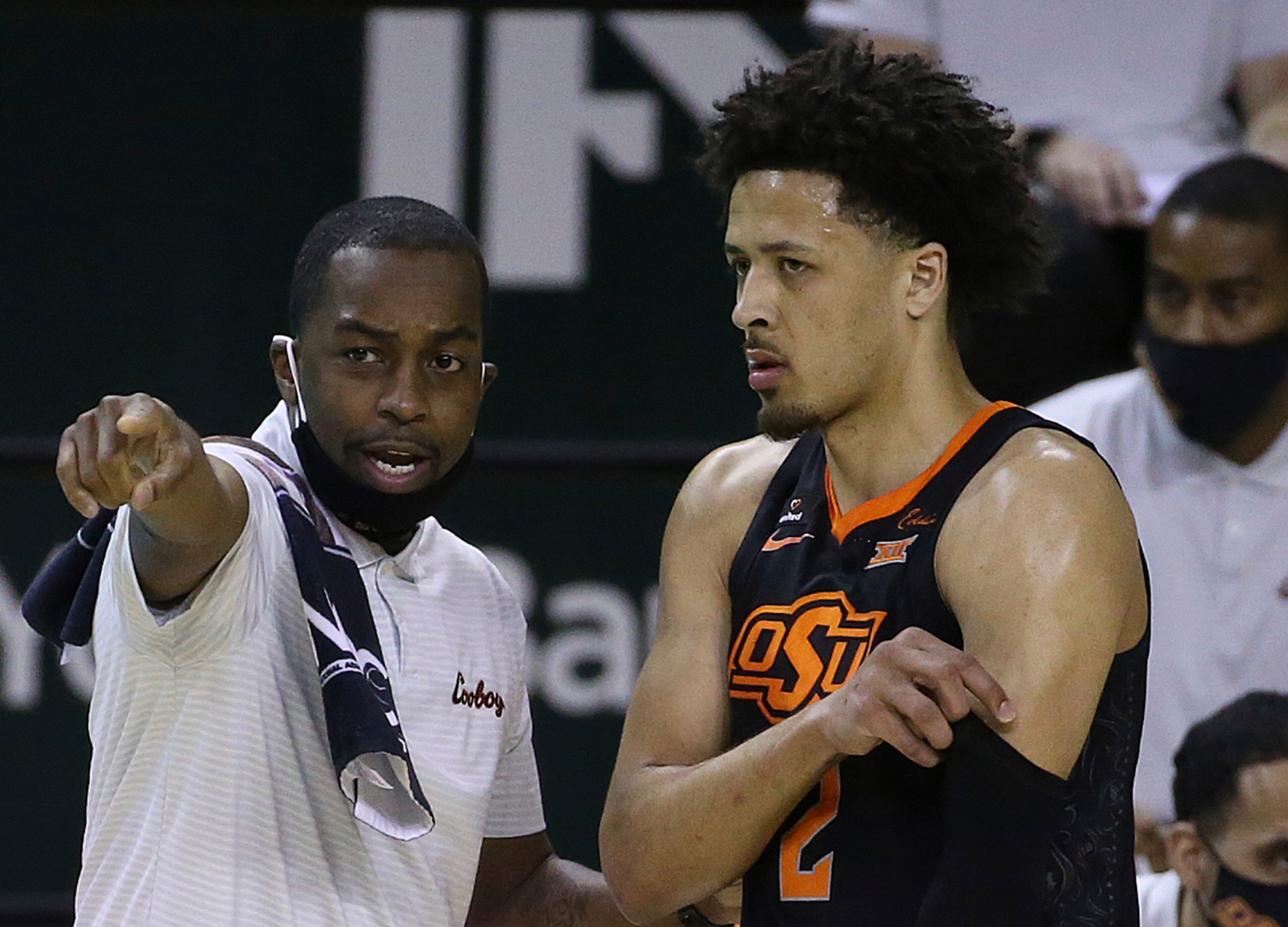 Oklahoma State's Cade Cunningham and Mike Boynton Oklahoma State's Cade Cunningham and Mike Boynton