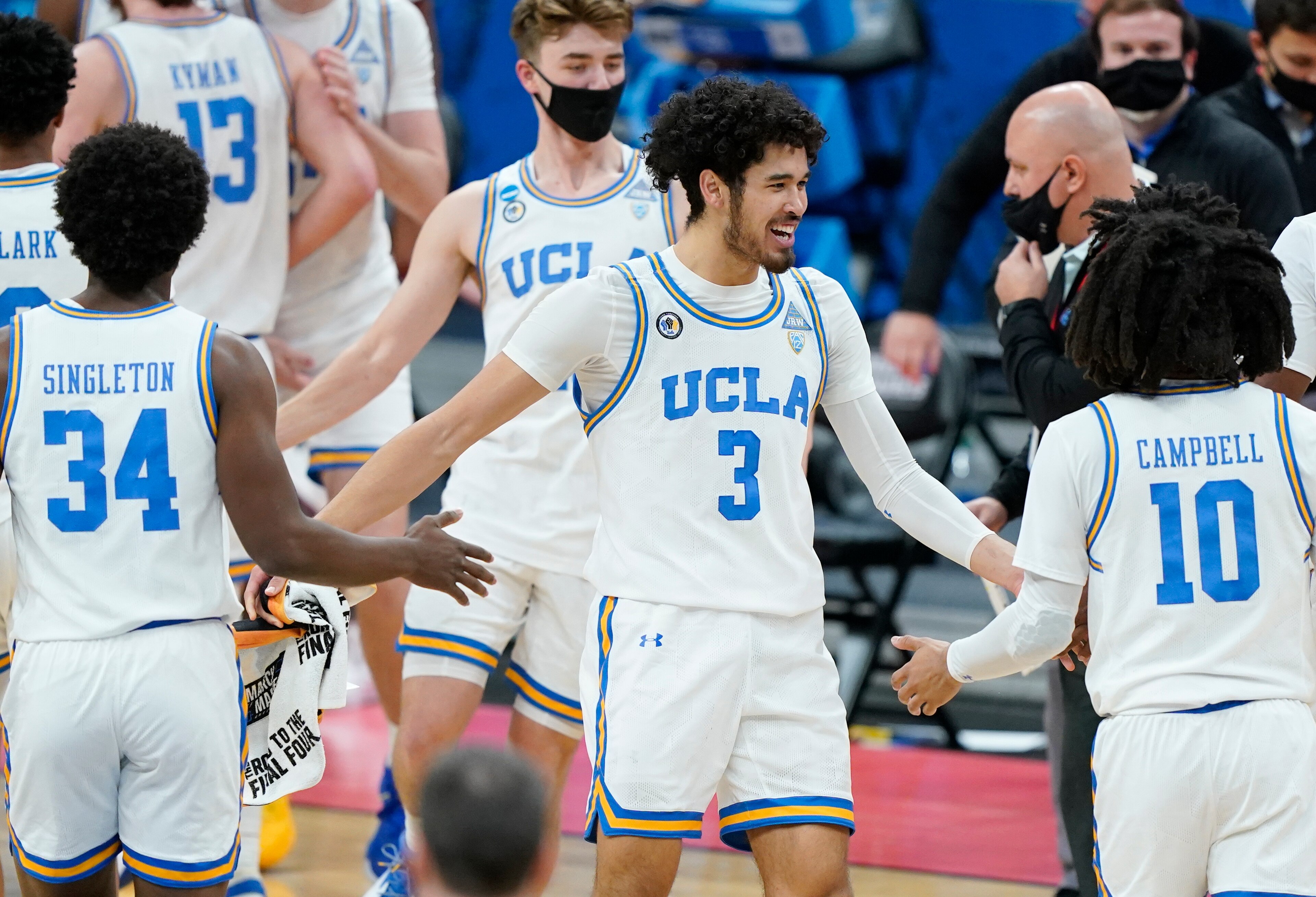 UCLA's Johnny Juzang (center)