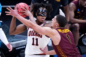 Illinois' Ayo Dosunmu and Loyola-Chicago's Lucas Williamson