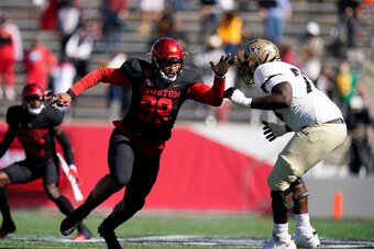 Houston defensive lineman Payton Turner (98) rushes against Edward Collins (70) during an NCAA football game against Central Florida on Saturday, Oct. 31, 2020 in Houston. (AP Photo/Matt Patterson)
