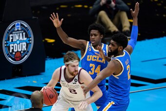 Gonzaga's Drew Timme and UCLA's Cody Riley (2) and David Singleton (34)