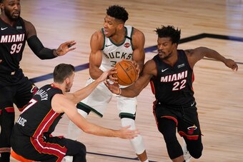 Jimmy Butler steals the ball from Giannis Antetokounmpo
