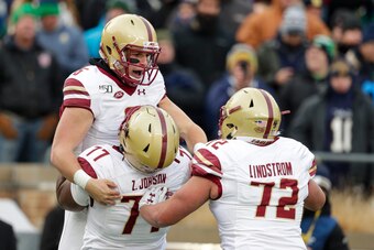 Boston College's Alec Lindstrom (72) and Zion Johnson (77)