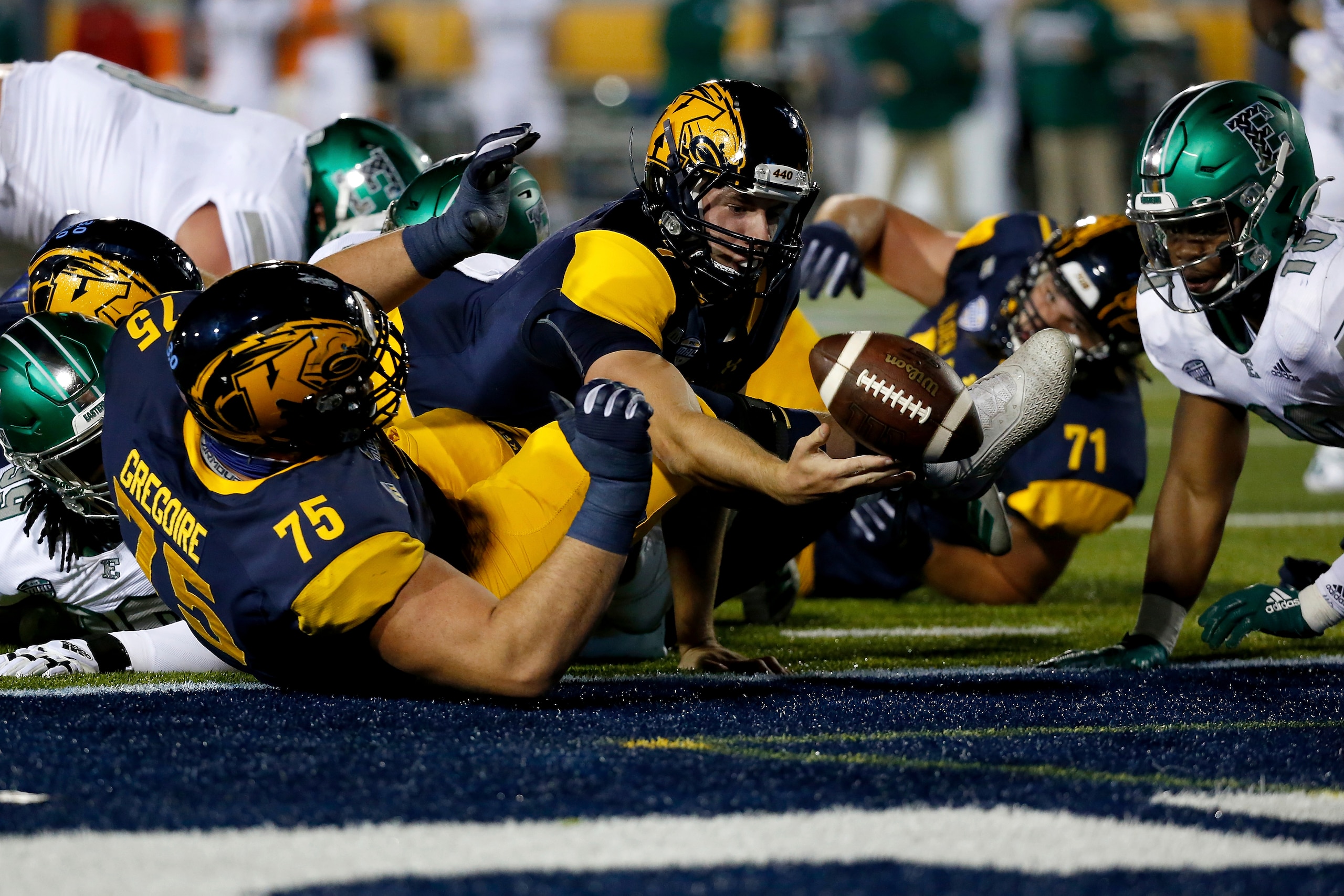 Kent State's Bill Kuduk (71) and Adam Gregoire (75) Kent State's Bill Kuduk (71) and Adam Gregoire (75)