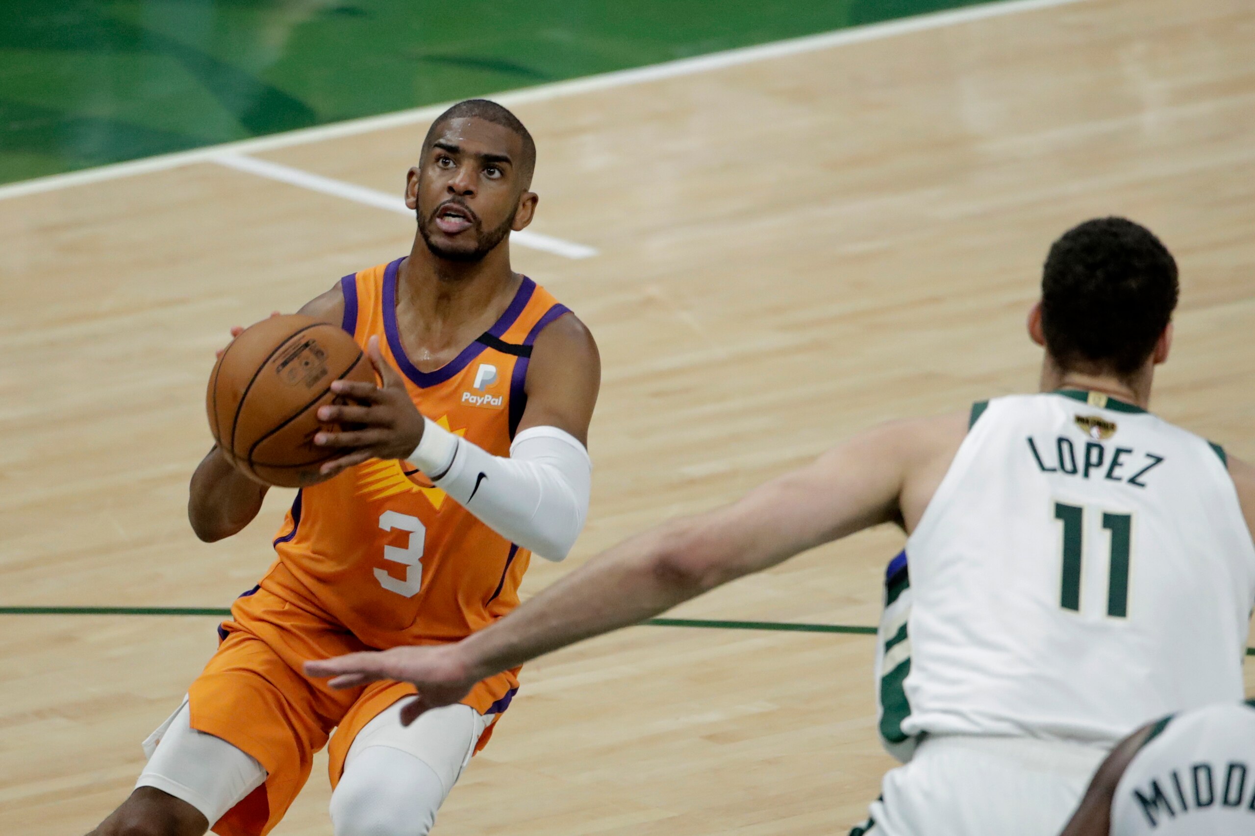 Phoenix Suns guard Chris Paul (3) shoots over Milwaukee Bucks center Brook Lopez (11) during the first half of Game 4 of basketball's NBA Finals Wednesday, July 14, 2021, in Milwaukee. (AP Photo/Aaron Gash) Phoenix Suns guard Chris Paul (3) shoots over Milwaukee Bucks center Brook Lopez (11) during the first half of Game 4 of basketball's NBA Finals Wednesday, July 14, 2021, in Milwaukee. (AP Photo/Aaron Gash)