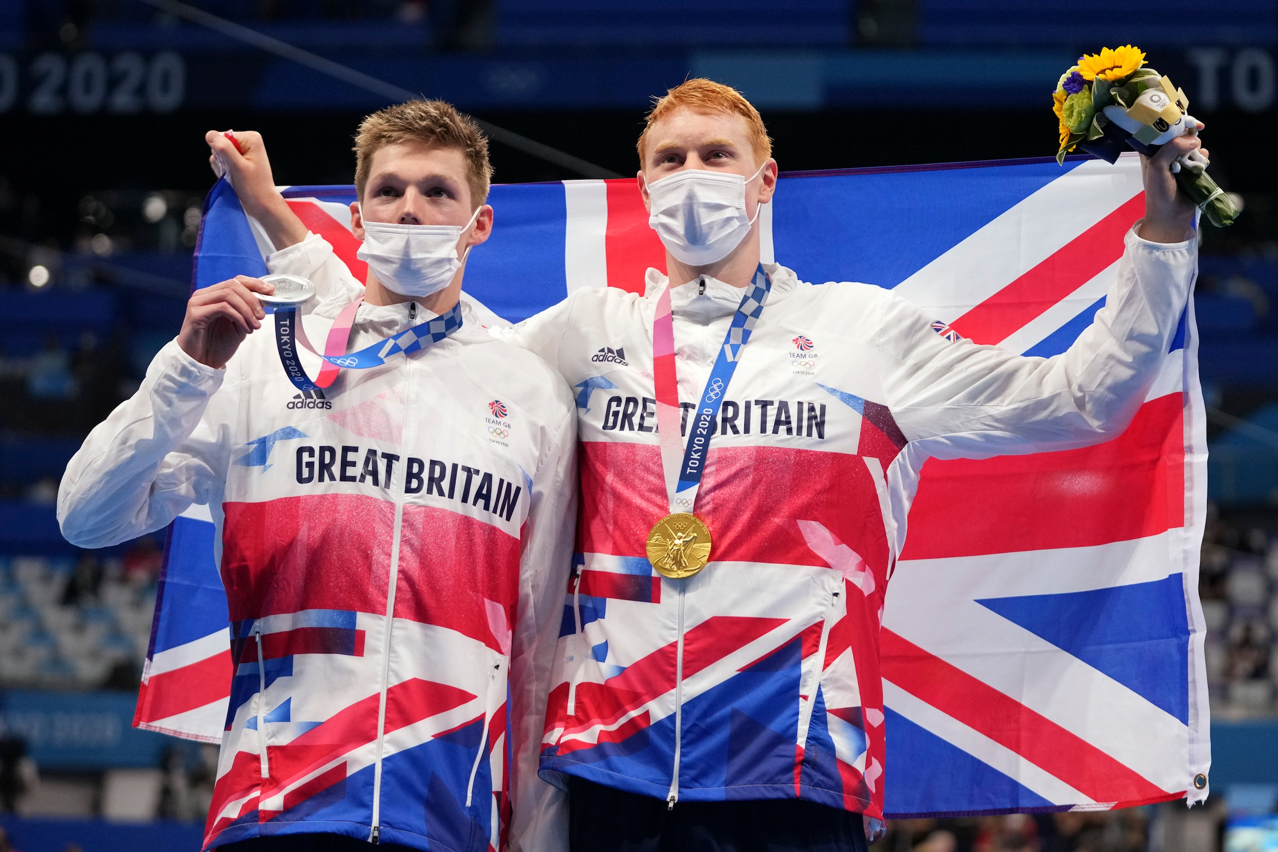 Great Britain's Tom Dean (gold) and Duncan Scott (silver)