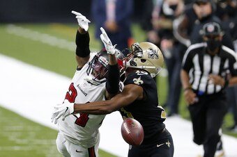 Buccaneers CB Carlton Davis III (left) and Saints WR Michael Thomas (right)