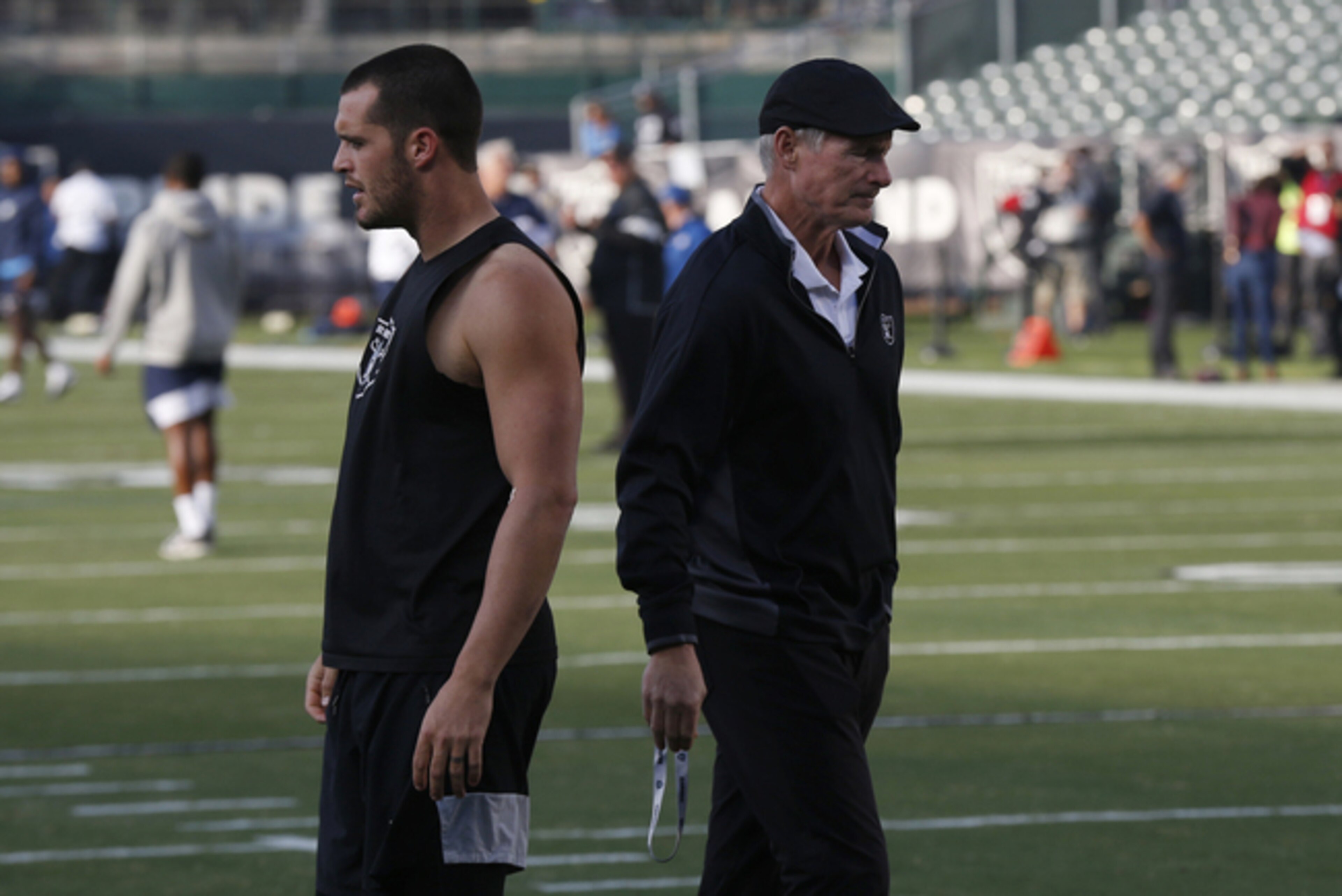 Las Vegas Raiders quarterback Derek Carr (left) and general manager Mike Mayock (right)