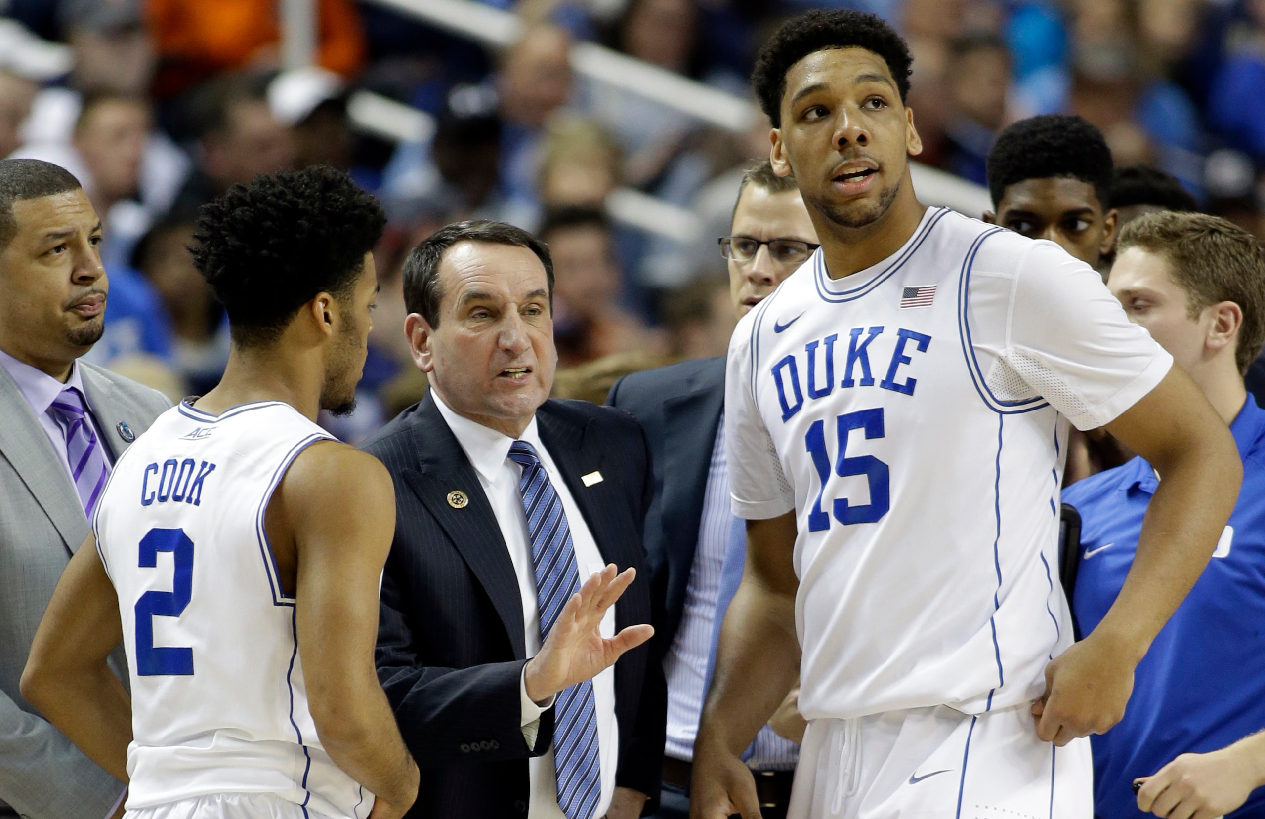 Duke's Quinn Cook (2), Jahlil Okafor (15) and Mike Krzyzewski