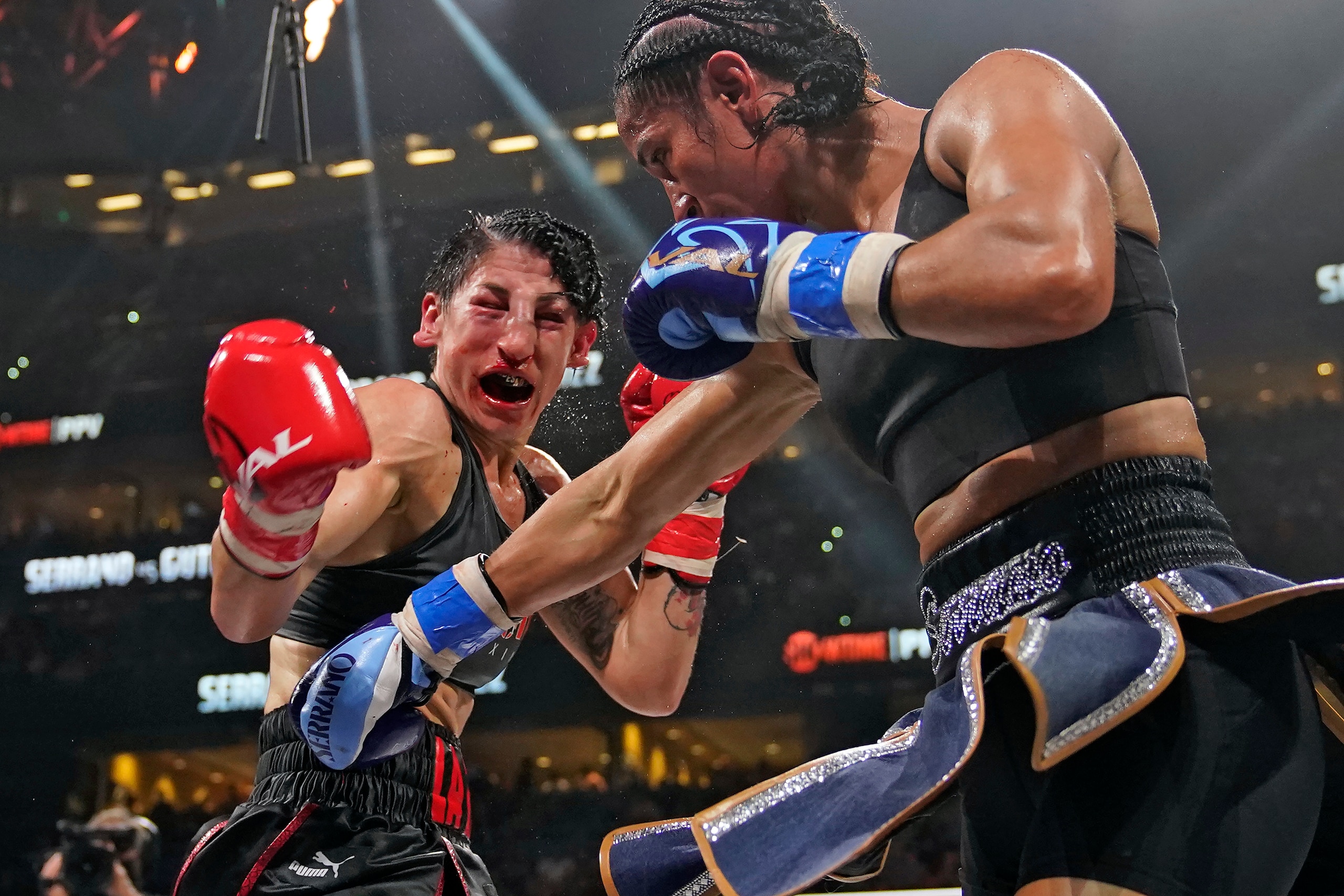 Amanda Serrano, right, lands a punch on Miriam Guttierrez, of Spain, during the 10th round of a Lightweight fight Saturday, Dec. 18, 2021, in Tampa, Fla. Serrano won by unanimous decision. (AP Photo/Chris O'Meara) Amanda Serrano, right, lands a punch on Miriam Guttierrez, of Spain, during the 10th round of a Lightweight fight Saturday, Dec. 18, 2021, in Tampa, Fla. Serrano won by unanimous decision. (AP Photo/Chris O'Meara)