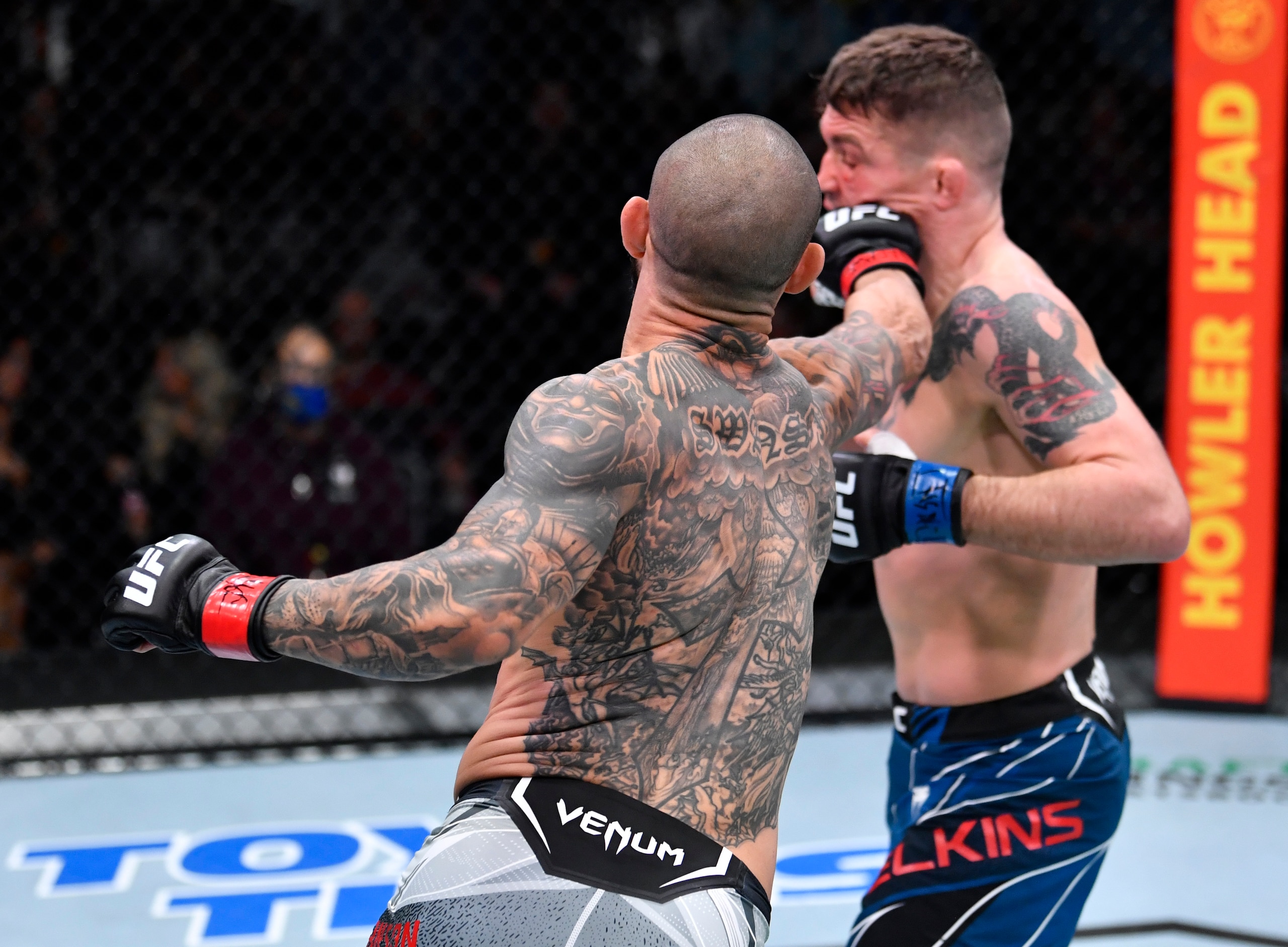 LAS VEGAS, NEVADA - DECEMBER 18: (L-R) Cub Swanson punches Darren Elkins in their featherweight fight during the UFC Fight Night event at UFC APEX on December 18, 2021 in Las Vegas, Nevada. (Photo by Jeff Bottari/Zuffa LLC)