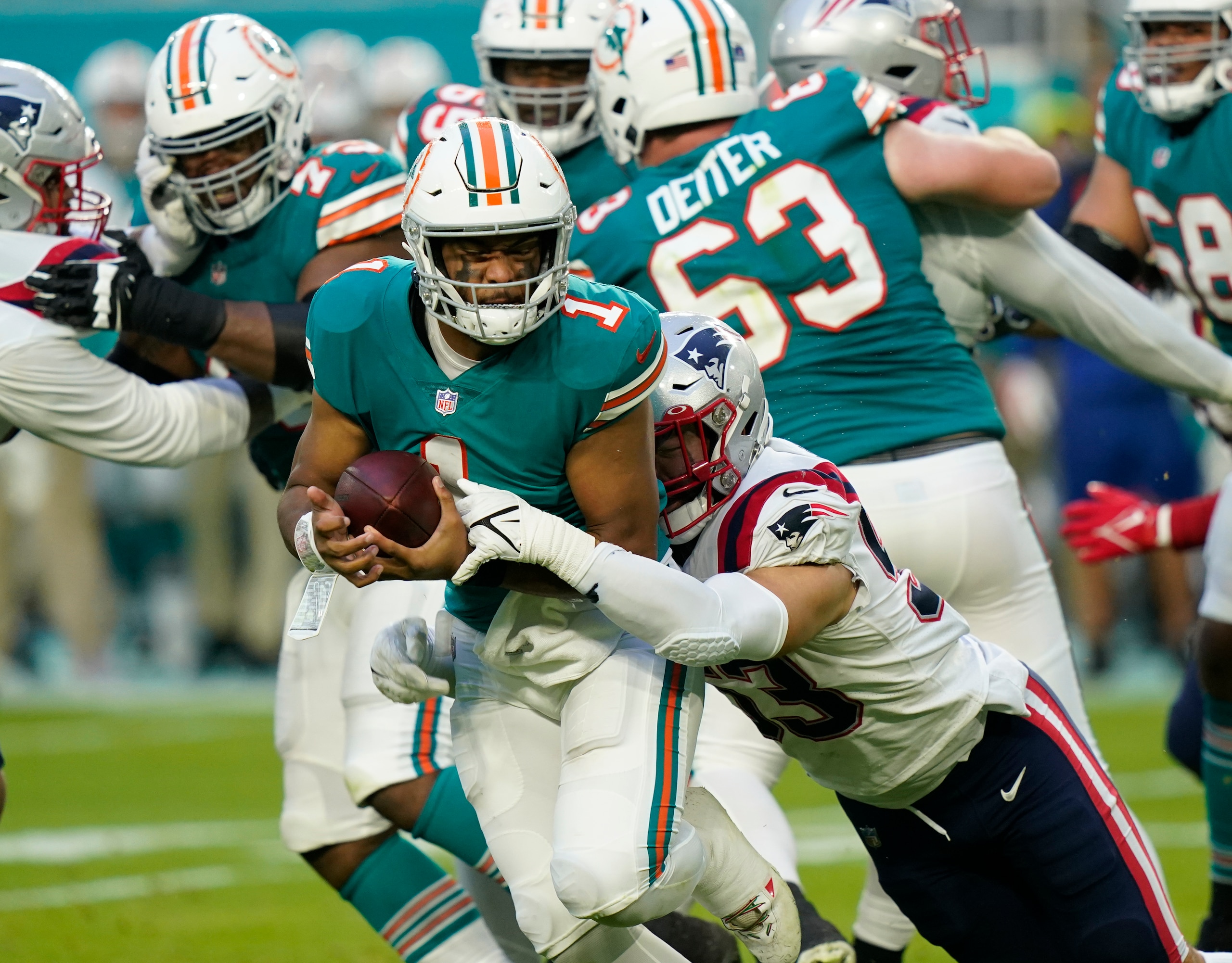 New England Patriots middle linebacker Kyle Van Noy (53) sacks Miami Dolphins quarterback Tua Tagovailoa (1) during the first half of an NFL football game, Sunday, Jan. 9, 2022, in Miami Gardens, Fla. (AP Photo/Lynne Sladky)