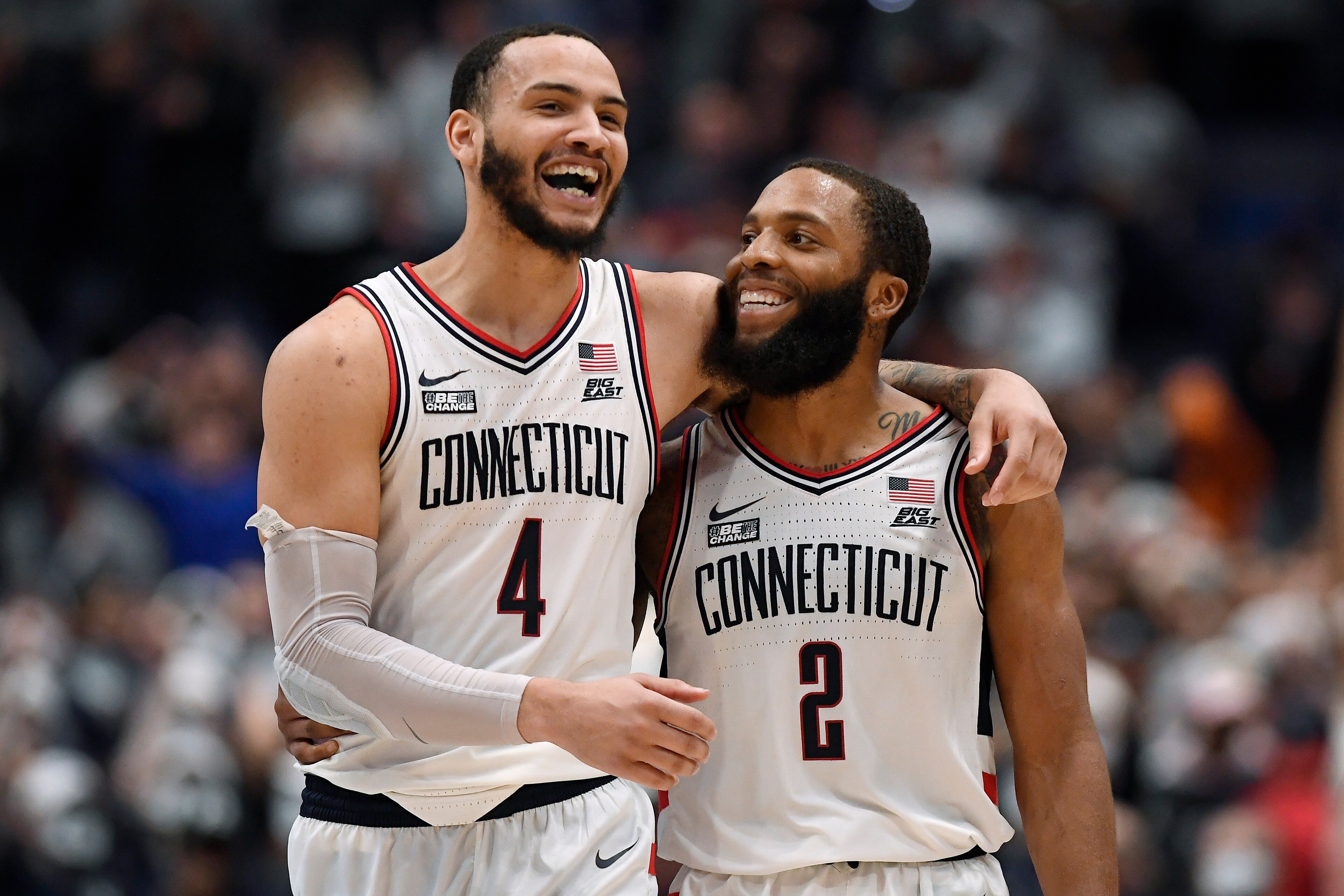 Connecticut's R.J. Cole (2) and Tyrese Martin (4)